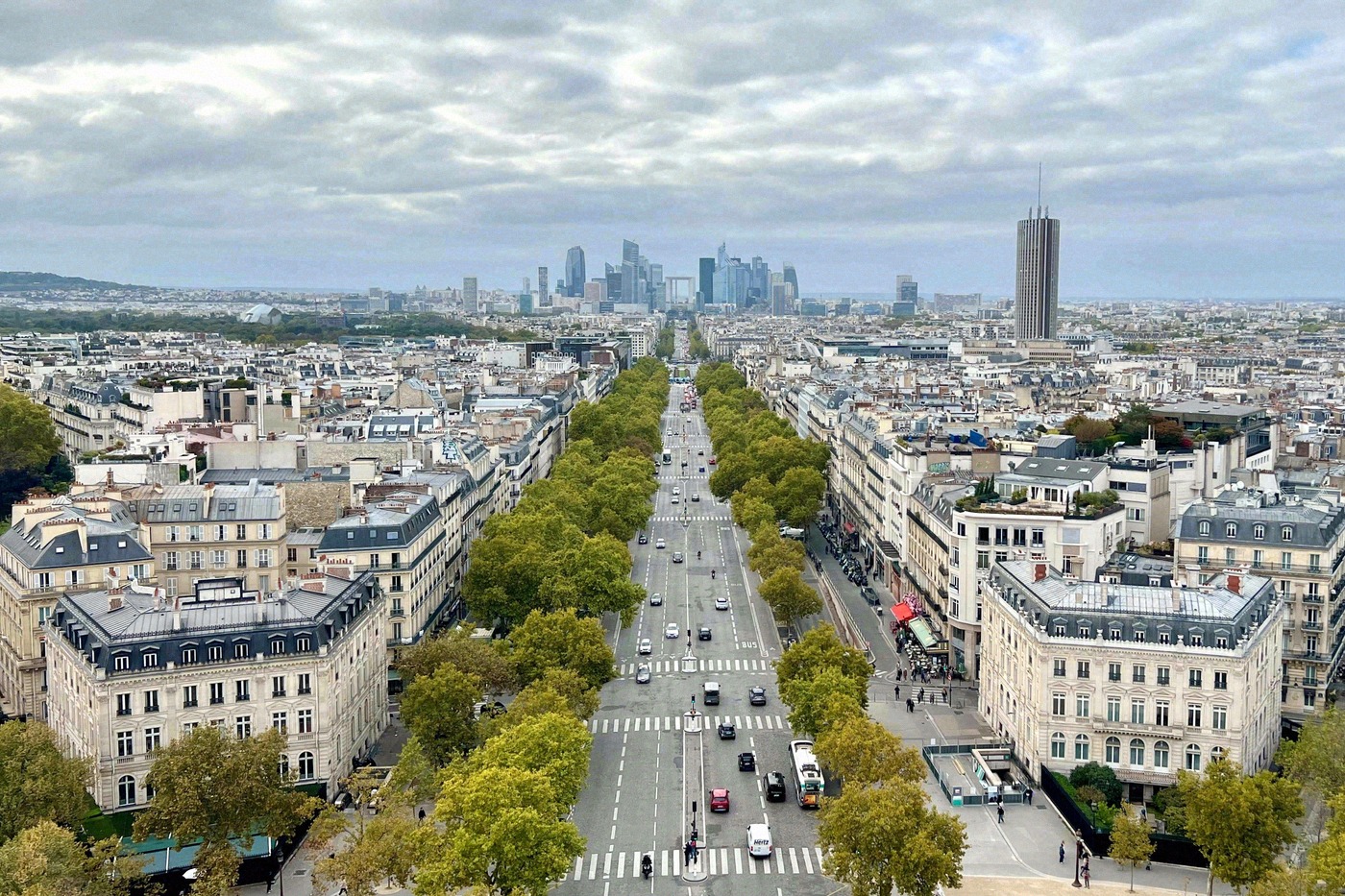 From the roof of the Arc de Triomphe, the view stretches along the tree-lined Champs-Élysées towards the